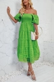Detail of light green off-shoulder tiered maxi dress with textured puff sleeves and mesh fabric - Green