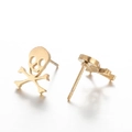 Matte gold skull and crossbones stud earrings in punk style shown on white background - Crossbones Skull Gold
