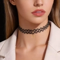 Close-up of black elastic tattoo choker featuring a gold stainless steel letter W pendant - Letter G Style