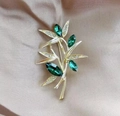 Bamboo brooch in gold finish with olive green marquise gems and white crystals - Marquise Green Gem Bamboo
