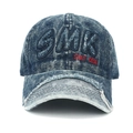 Detail of distressed brim and SMK embroidery on vintage blue denim baseball cap - Adjustable / Washed Dark Blue