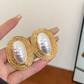 Vintage style gold earrings with oval pearls and textured frames held in hand - 85# Silver Needle-Gold (Oval)