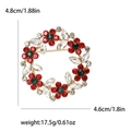Floral crystal wreath brooch with red and green stones on a golden metal base - White Red Green Rhinestone