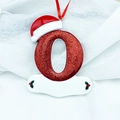 Glittering red Christmas letter O ornament with Santa hat and holly berry detail - Letter O