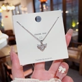 Elegant silver heart necklace with wings and a sparkling zircon pendant on a card - X283 Titanium Steel Color Retention