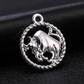 Macro view of vintage silver Taurus zodiac pendant with a twisted rope circular frame - Style 9 / Antique Silver