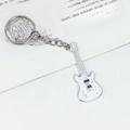 Silver metal guitar keychain featuring white enamel finish and treble clef detail - New Mini White Guitar