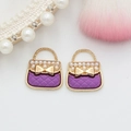 Detail of purple handbag charms with gold lattice, bow accent and small pearls - Purple