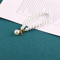 Elegant white glass pearl phone strap with a large pearl pendant and golden metal clasp - Gold Rhinestone Pearl Style