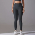 Close-up of high-waist charcoal grey yoga leggings with seamless design and elastic fabric - Graphite Grey