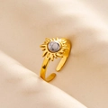 Detail of adjustable gold ring with sunflower design and white marble texture stone - Gold-White Marble