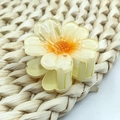 Pale yellow transparent 4cm plumeria claw clip with glitter finish on woven mat - Orange Sunflower