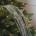 Silver sequin tassel strands on a Christmas tree branch with warm festive lights - Waterfall Tassel Pick - Aesthetic Silver 80CM