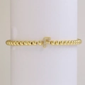 18k gold plated beaded elastic bracelet featuring a crystal-encrusted letter F charm - Letter F