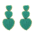 Bohemian turquoise beaded triple heart drop earrings with gold border on white background - Green