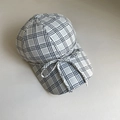 Vista dall'alto di un cappellino da baseball a quadretti con fiocco decorativo - M (56-58cm) / Quadri Nero