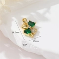 Detailed view of 14k gold-plated clover pendant with green zircons and dimension marks - Green Zircon Clover
