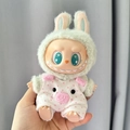 Labubu doll outfit featuring light green bunny ears hat and white pink polka dot jumpsuit - Pink Polka Dot Pig Pendant / First And Second Generation Keychains Are Compatible With La Cloth Dolls. Dolls Not Included.