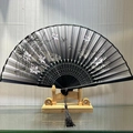 Classic Chinese black folding fan with lotus and dragonfly patterns and silk tassel - Lotus Out of Water