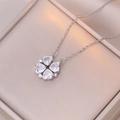 Macro detail of silver magnetic clover necklace showing four heart-shaped zirconias - White Heart Clover (Silver Chain)