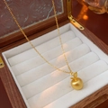 Detailed macro of 18k gold plated apple pendant resting in a velvet jewelry box - Gold (Real Gold Plated)
