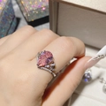 Silver ring with pear-shaped pink gemstone and white cubic zirconia stones on hand - Pink Diamond Ring Ljz-247 / Adjustable Open