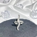 Detail of silver snake ring with black gemstone and textured scales on dark stone - Style 5 Adjustable Ring