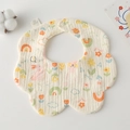 Detailed view of petal-shaped cotton baby bib featuring cartoon rabbits and rainbows - Gauze Flower Wrap - Garden Pink Rabbit