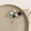 Detailed view of 3-piece hair clip set with pearls and colorful geometric gems on a tray - Style 1 (3-Piece Set/Blue-Green-Pink-White)