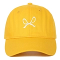 Detail of white ribbon bow embroidery on a bright yellow cotton canvas baseball cap - Yellow