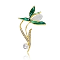 Detailopname van een gouden lelietje-van-dalen broche met groen email en witte parel - Blauw