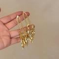 Detail of long gold tassel earrings with delicate chains and leaf-shaped metal pendants - Long Wheat Ear Tassel / Real Gold Plated Gold (Silver Needle)