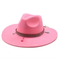 Detail of pink suede sun hat featuring ethnic tassel band and metallic pendant - M (56-59cm) / Hot Pink