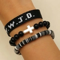 Close-up of black and white WWJD woven bracelet with cross bead and clay disc set - Three-Piece Set / Black