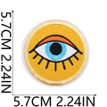 Close-up of 5.7cm round sun eye embroidered patch with detailed orange and black stitching - Style 13 (Blue Eye)