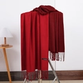 Dual-color dark red cashmere scarf with fringe hanging on a minimalist metal rack - No.2 Jujube Red