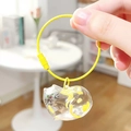 Cat-shaped clear capsule keychain with yellow cat hair storage and steel ring - New Box - Calico Cat