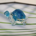 Blue crystal turtle figurine with gold flakes and a translucent resin finish - Sky Blue + Gold Foil