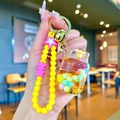 Handheld liquid pumpkin quicksand bottle keychain with yellow beads and golden bell - Pearl Rope [yellow] Colorful Bean Gas Cylinder