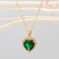 Elegante goldene Herz-Halskette mit smaragdgrünem Kristall und weißem Diamantrand - Grün
