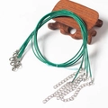 Green 1.5mm waxed cord necklace with silver lobster clasp on wooden display stand - Grass Green