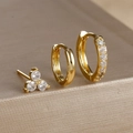 Macro shot of three-piece gold earring set featuring a clover stud and zircon hoops - Gold (Y26071-2)
