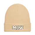 Close-up of beige knit beanie with MINI embroidery detail and warm ribbed texture - Kids Style(MINI) / Beige