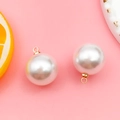 White drop pearl pendant with golden hanging loop on pink background for DIY jewelry - 16mm KC Gold Round