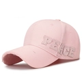 Pink baseball cap featuring 'PEACE' patch embroidery with distressed frayed edges - Pink