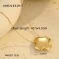 Detailed view of a gold star pendant necklace with dimensions on a textured stone surface - Cross / Gold