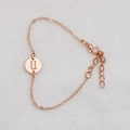 Rose gold hollow circular bracelet featuring a round letter U pendant and lobster clasp - Rose Gold U