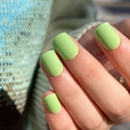Short square matte lime green press-on nails shown against a blue knit background - Matte Lime Green Style (JP3171) - Glue Type