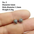 Macro shot of 6mm silver lantern spacer beads with embossed cross pattern for DIY jewelry - 2# (Diameter 6mm Hole 1.5mm)