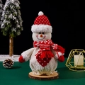 Detail of Christmas snowman plush figure with red polka dot hat on natural wood base - Red and White Snowman